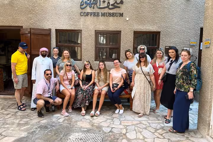 Tour group at Dubai Coffee Museum in Al Fahidi, cultural stop on private Dubai city tour from Abu Dhabi