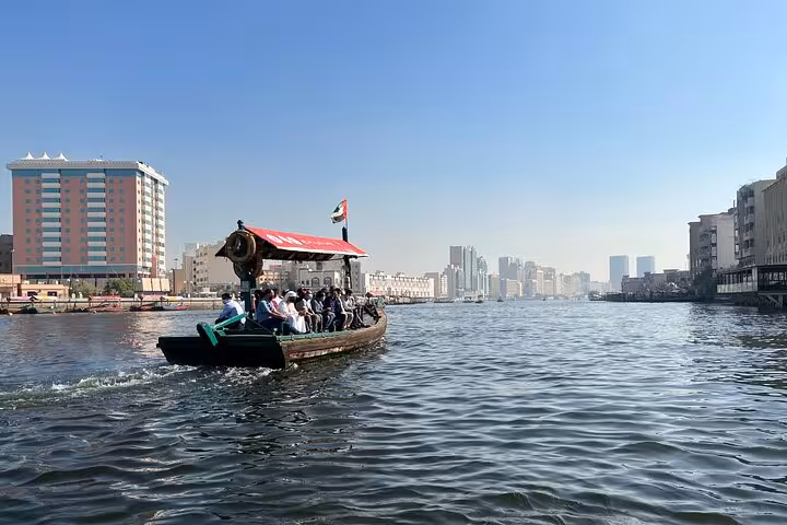 Dubai Creek abra boat ride in Old Town Deira, scenic waterway view on private half-day city tour