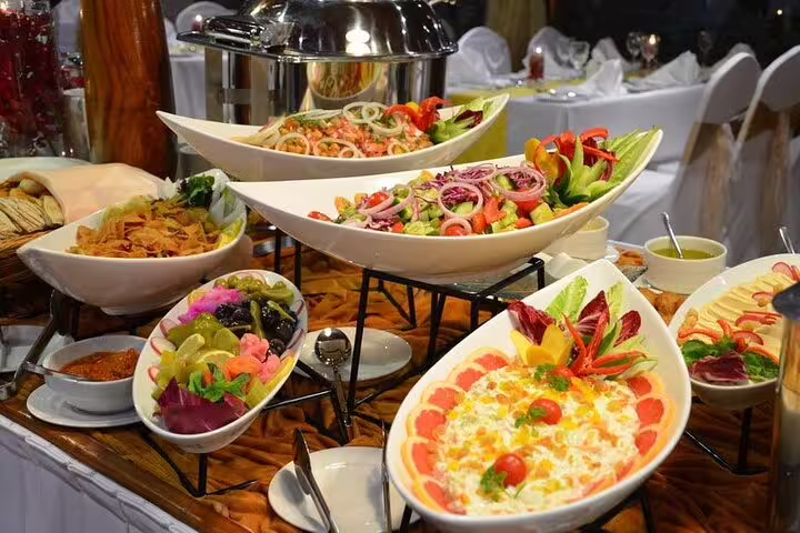 Colorful spread of fresh salads and appetizers at Dubai desert safari BBQ buffet.