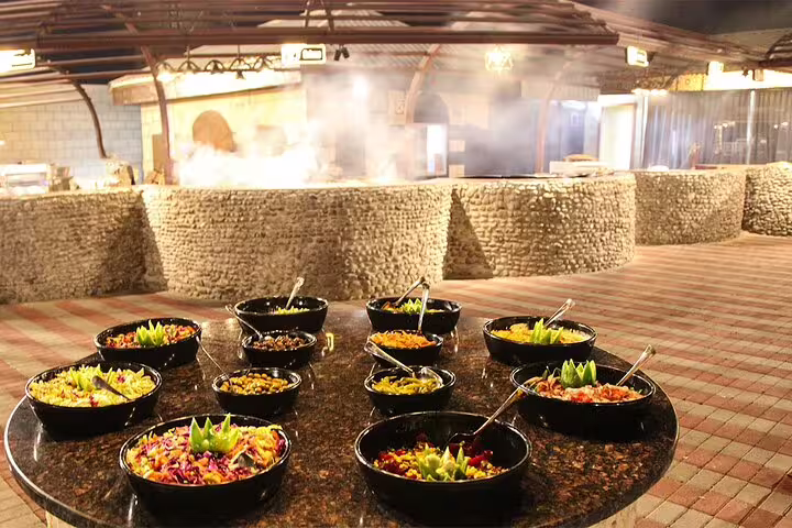 A vibrant salad buffet awaits guests at the Dubai desert safari, enhancing the dining experience with fresh flavors.