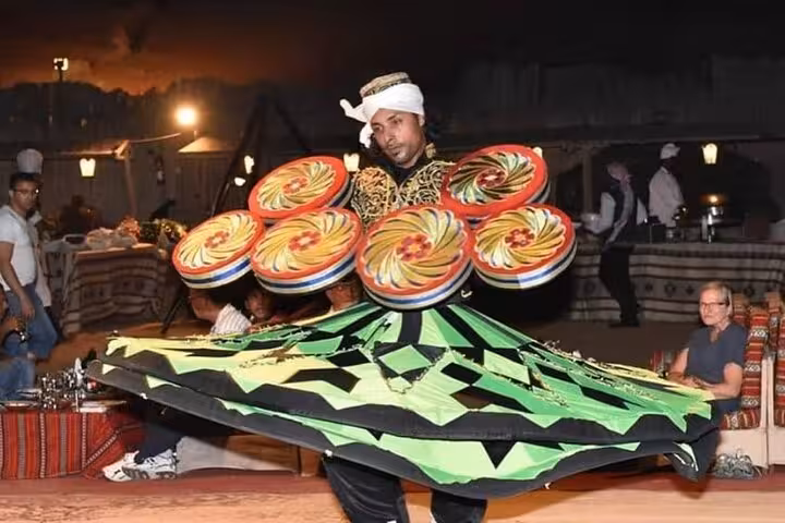 Tanoura dancer performing at Dubai desert safari camp with BBQ dinner and live fire show entertainment