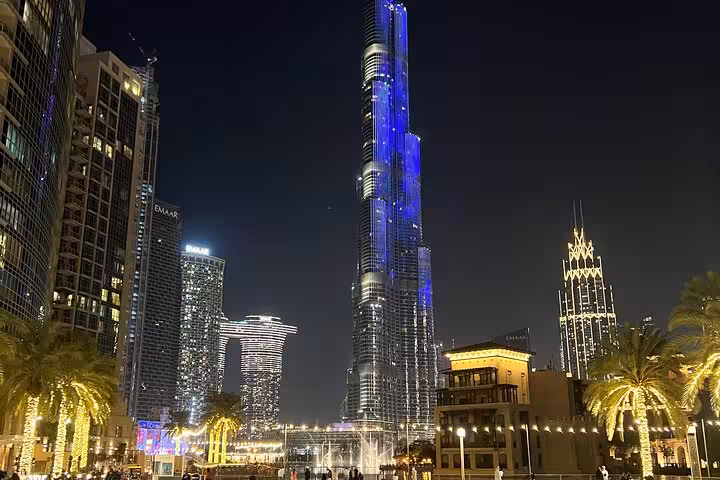Dubai Fountain show at night with Burj Khalifa views, part of Dubai Creek Mall sunset tour