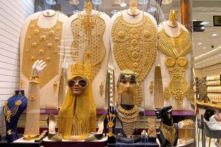 Discover opulent gold jewelry displays at Dubai's famous Gold Souk, a highlight of the Old and Modern Dubai tour.