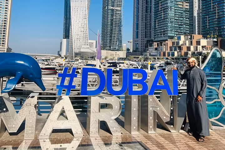 Photo stop at #Dubai Marina sign with skyline views on Dubai city tour including Ain Dubai entrance tickets