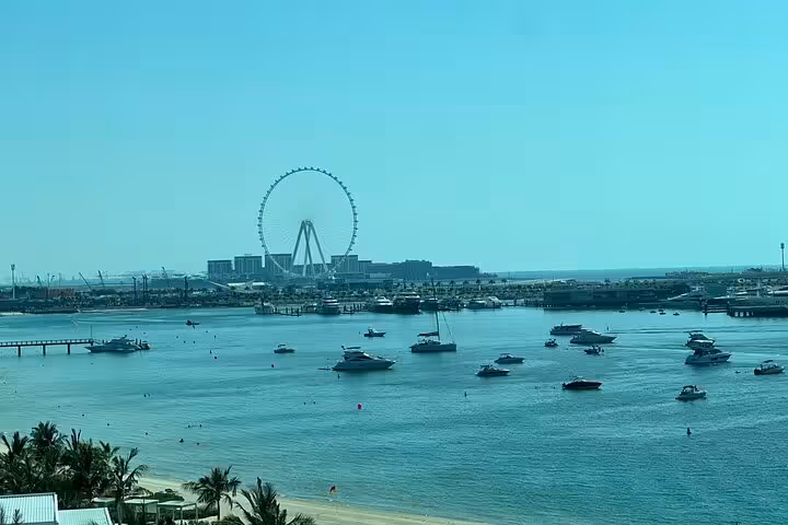 Dubai Marina skyline and Ain Dubai over the water, seen on Palm Jumeirah tour with The View at The Palm tickets