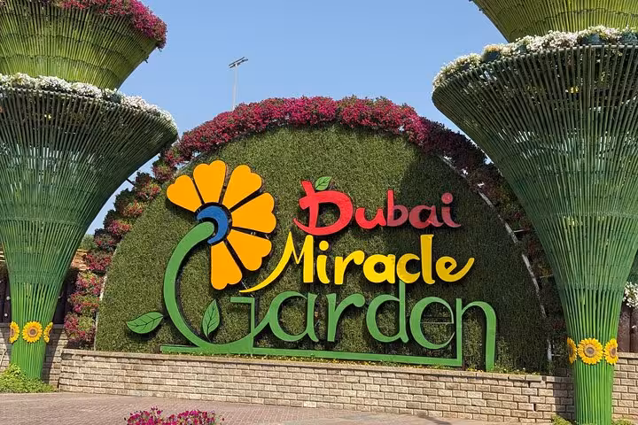 Dubai Miracle Garden floral sign and towering flower structures, ideal add-on to Ras AlKhaimah adventure pass
