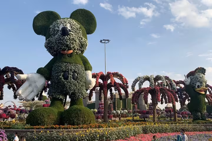Dubai Miracle Garden Mickey floral topiary and colorful arches, ideal day trip with Ras AlKhaimah Adventure Await pass