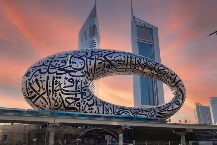 Futuristic Museum of the Future in Dubai with Arabic calligraphy at sunset, showcasing modern architectural marvels.