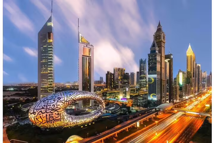 Night view of Dubai's futuristic skyline featuring the Museum of the Future, a highlight on a 4x4 city tour.