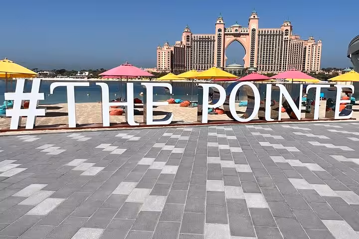 The Pointe at Palm Jumeirah with Atlantis hotel backdrop, photo stop on Dubai half-day city tour