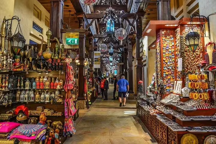 Traditional Dubai souk market alley with lanterns and souvenirs on a private full-day customizable tour