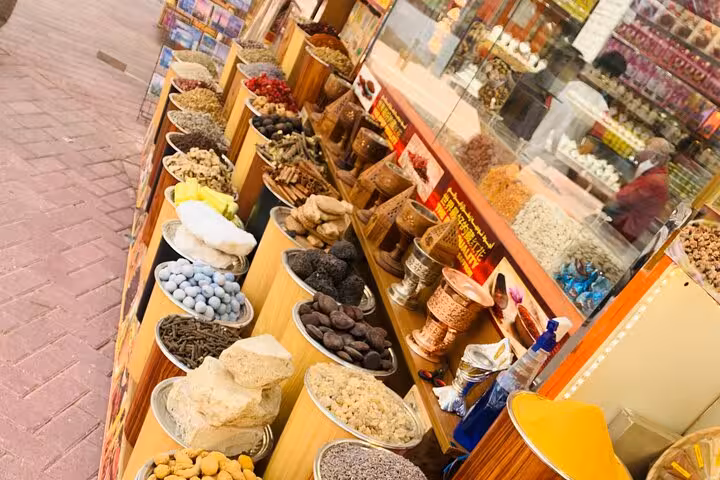 Dubai souk spice and dried fruit stalls, a cultural stop on multi day Dubai to Abu Dhabi adventure tour