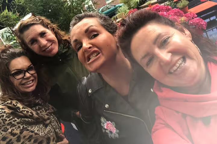Group selfie at a Dublin flower market during a self-guided e-scavenger hunt city exploration game