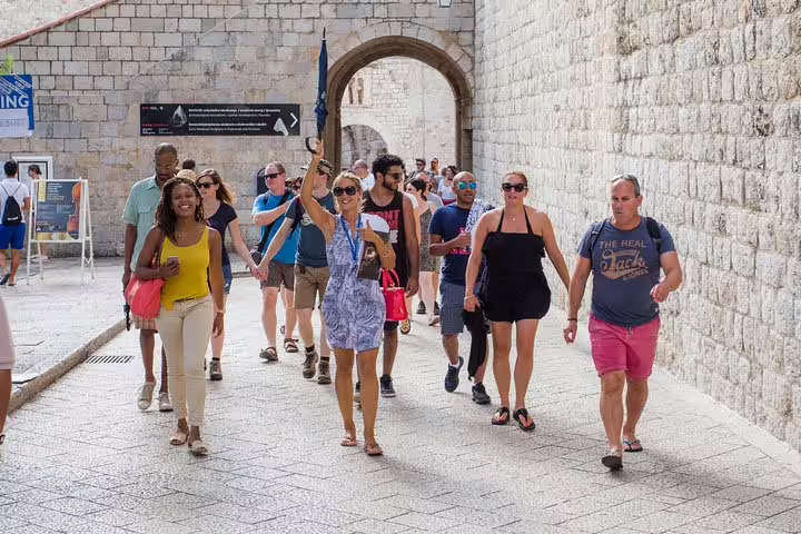 Guided group walking through Dubrovnik Old Town gate on the Walk the King's Landing Streets King's Landing tour