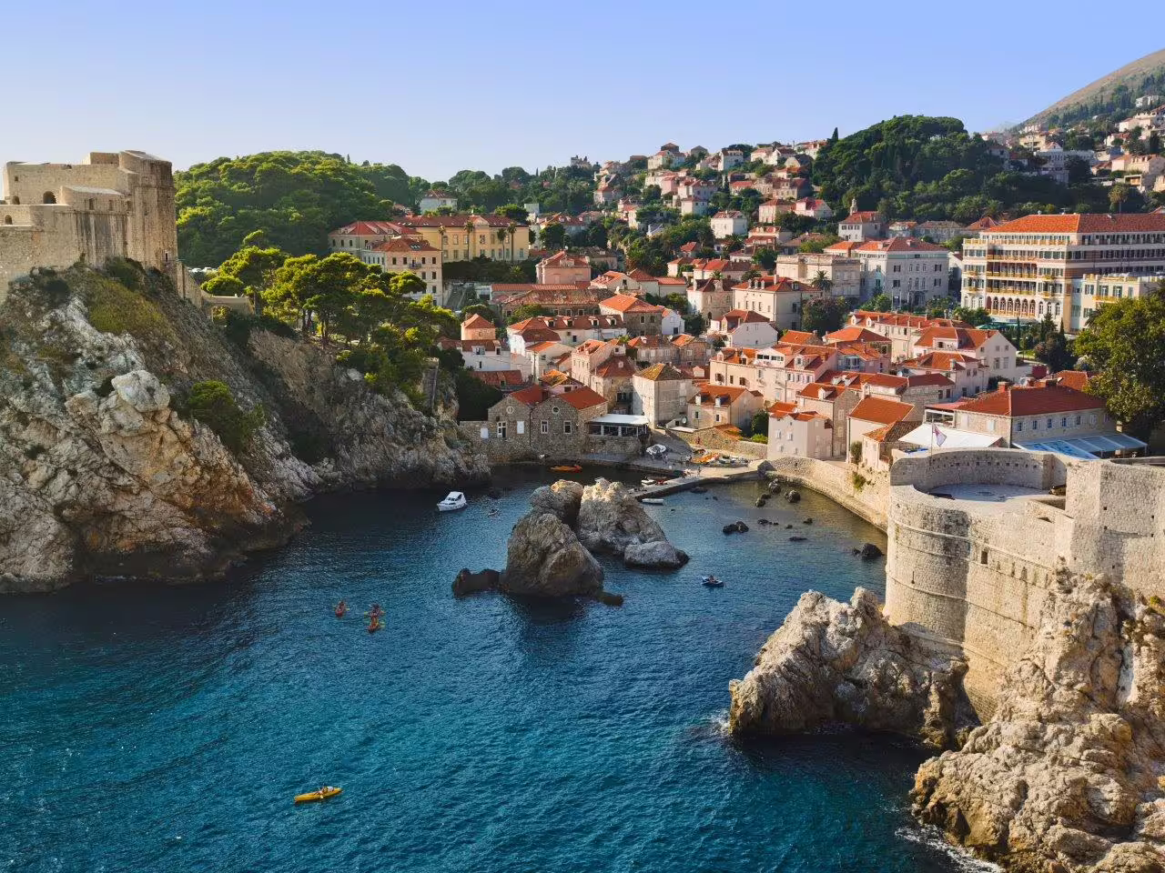 Dubrovnik Old Town walls and red rooftops above the Adriatic bay, highlight of Kings, Dragons & Lions city break