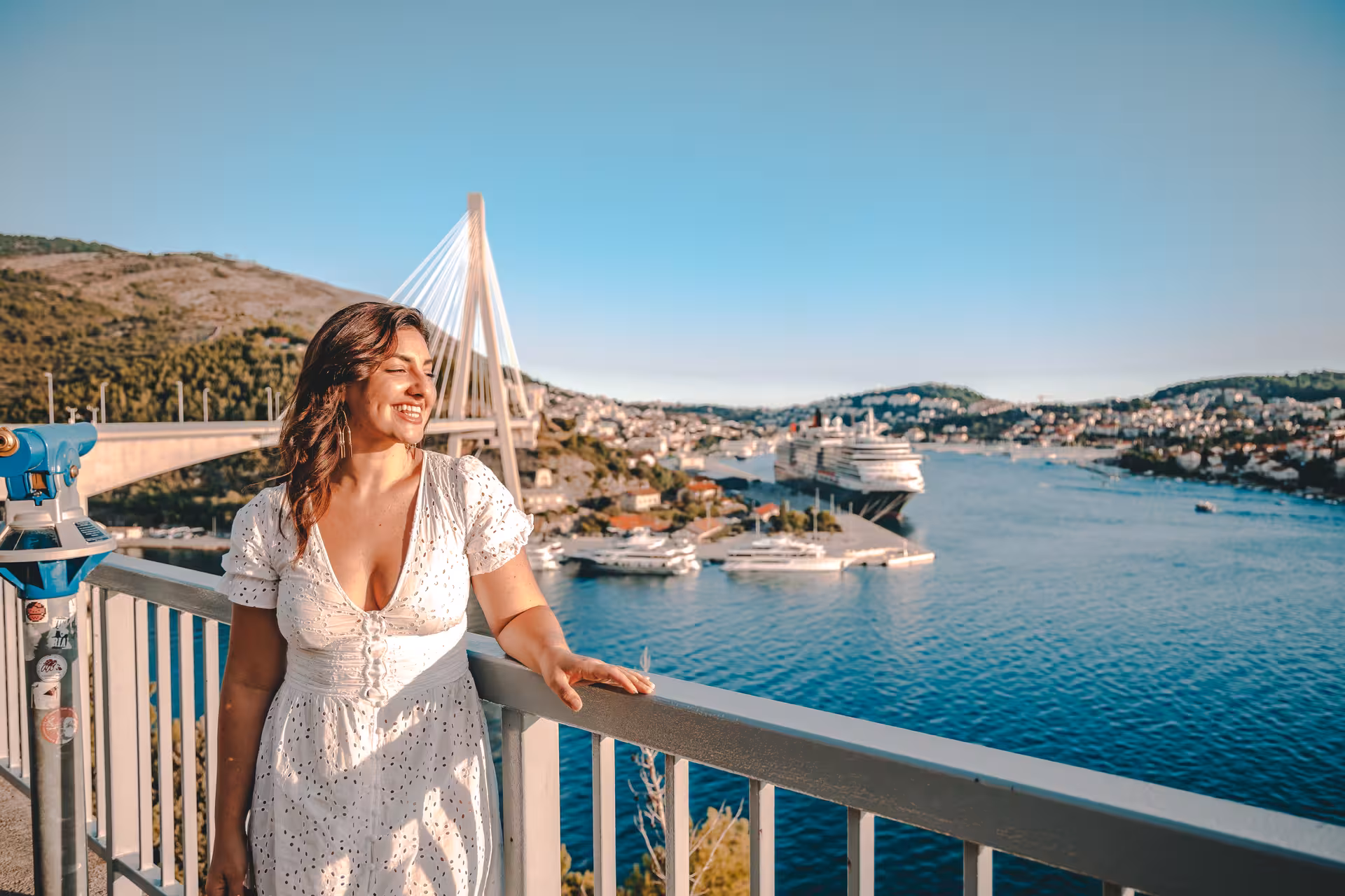 Traveler enjoying panoramic Dubrovnik views over Gruz Harbor and bridge, perfect for history and scenery city tour
