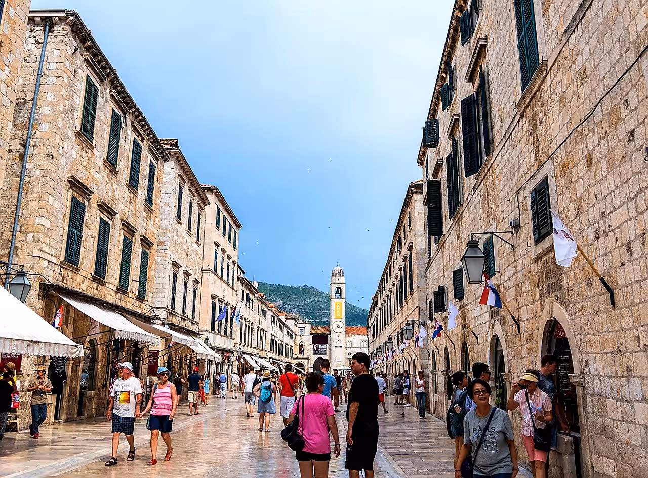 Stradun promenade in Dubrovnik Old Town with Sponza Palace area and crowds on a guided history and scenery city tour