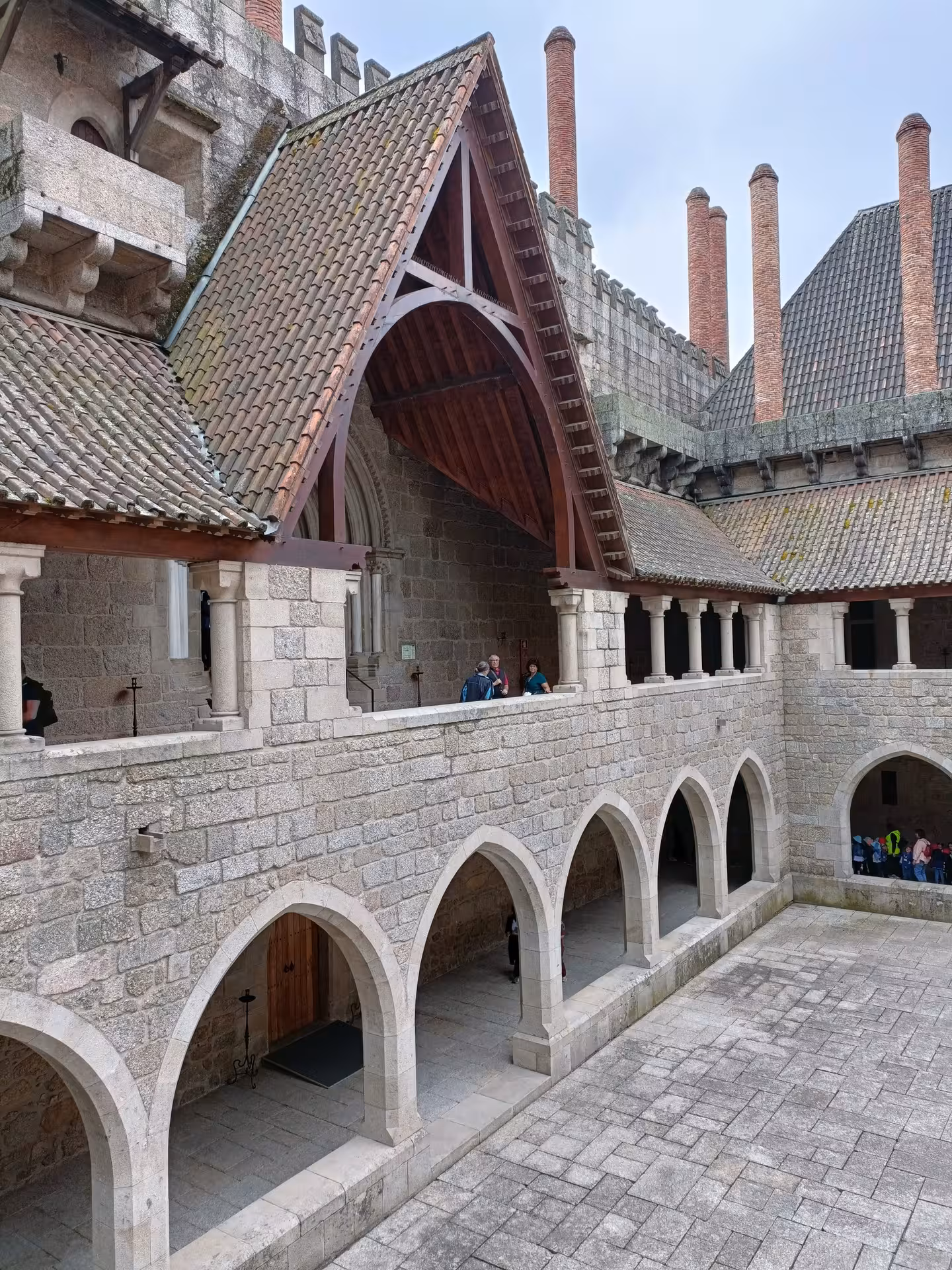 Ducal Palace of Guimarães courtyard arches, a highlight on a private Guimarães and Braga tour with lunch