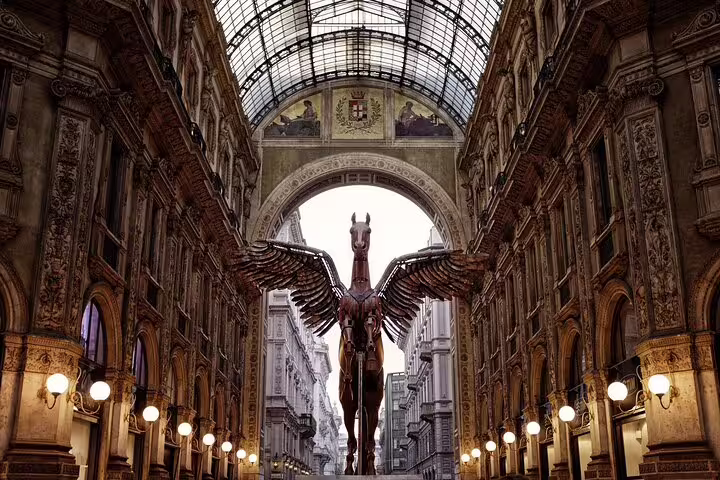 Interior of Galleria Vittorio Emanuele II with winged horse sculpture, a highlight near Duomo Cathedral on private Milan tours