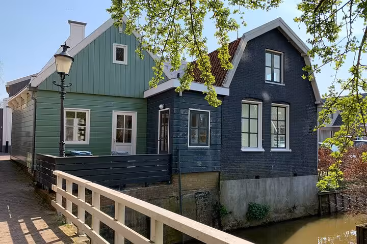 Historic Dutch canal house in Delft, scenic stop on Best of Dutch Legacy private tour from The Hague
