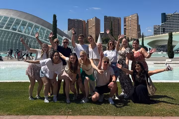 Group photo on Dutch Valencia bike tour at the City of Arts and Sciences, sunny cycling sightseeing stop