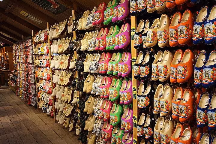Colorful Dutch wooden clogs display in Zaanse Schans shop on a private windmills, cheese and clogs tour
