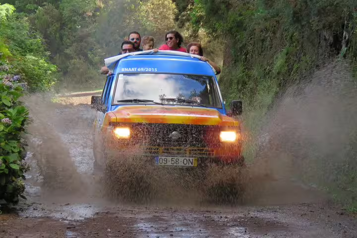 Off-road jeep adventure in East Madeira's lush landscapes, exploring peaks and the charming village of Santana.