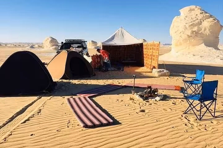 Eco desert camp with tents and Bedouin lounge in White Desert on 3-day Bahariya Oasis camping tour