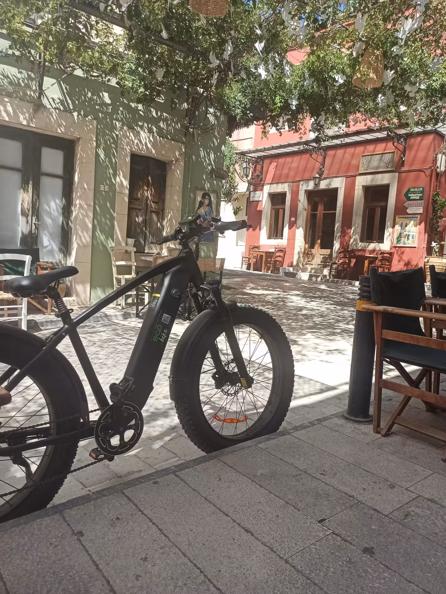 Eco e-bike parked in a shaded Cretan old-town street, ideal for Discover the Real Crete bike tour