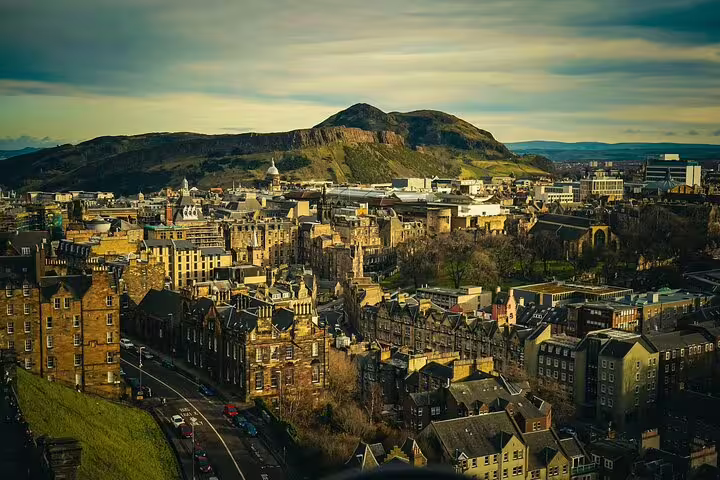 Edinburgh skyline with Arthur’s Seat at sunset, Highland capital stop on a private Loch Ness tour