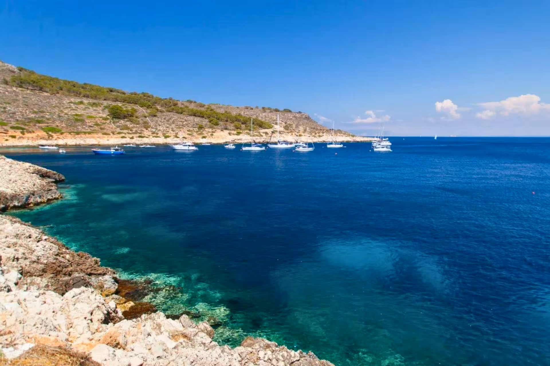 Panoramic Egadi Islands bay near Favignana with anchored yachts, private boat tour from Trapani incl lunch