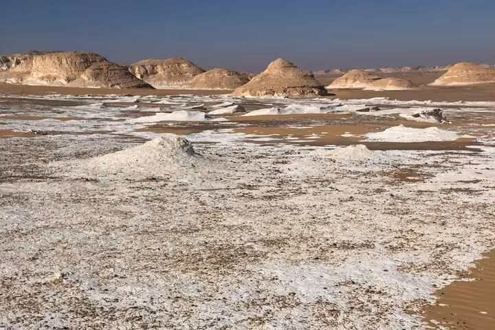 Wide view of Egypt White Desert salt flats and chalk rocks on a private 2-day Black and White Desert safari