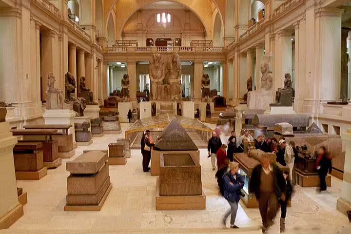Main gallery of the Museum of Egyptian Antiquities with statues and sarcophagi on a private Cairo museum tour