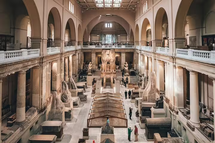 Grand hall of the Museum of Egyptian Antiquities, Cairo, with statues and exhibits on private guided tour