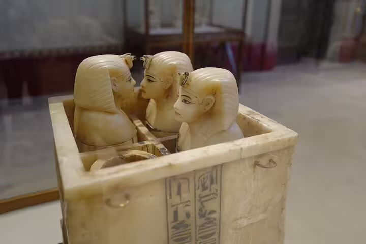 Ancient Egyptian canopic jar set at Egyptian Museum Cairo on Pyramids of Giza and Cairo day trip by bus