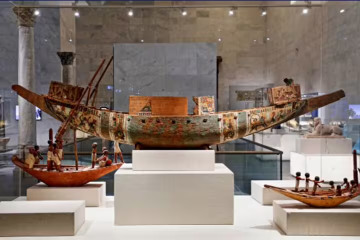 Painted ancient Egyptian funerary boat models on display at the National Museum of Egyptian Civilization, Cairo