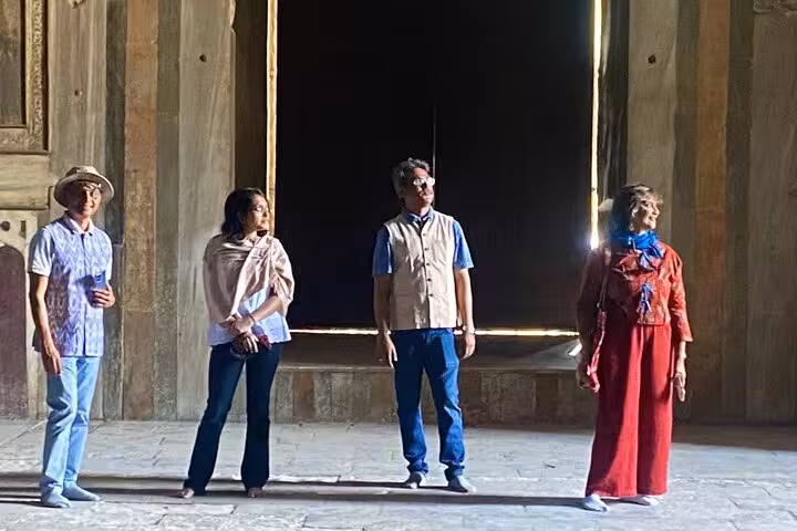 Visitors explore the interior of the Egyptian Museum, admiring ancient artifacts and the grandeur of historical architecture.