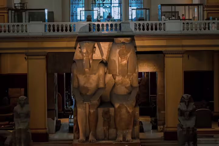 Colossal statues inside the Egyptian Museum Cairo, highlight of Luxor to Cairo day trip by flight in Egypt