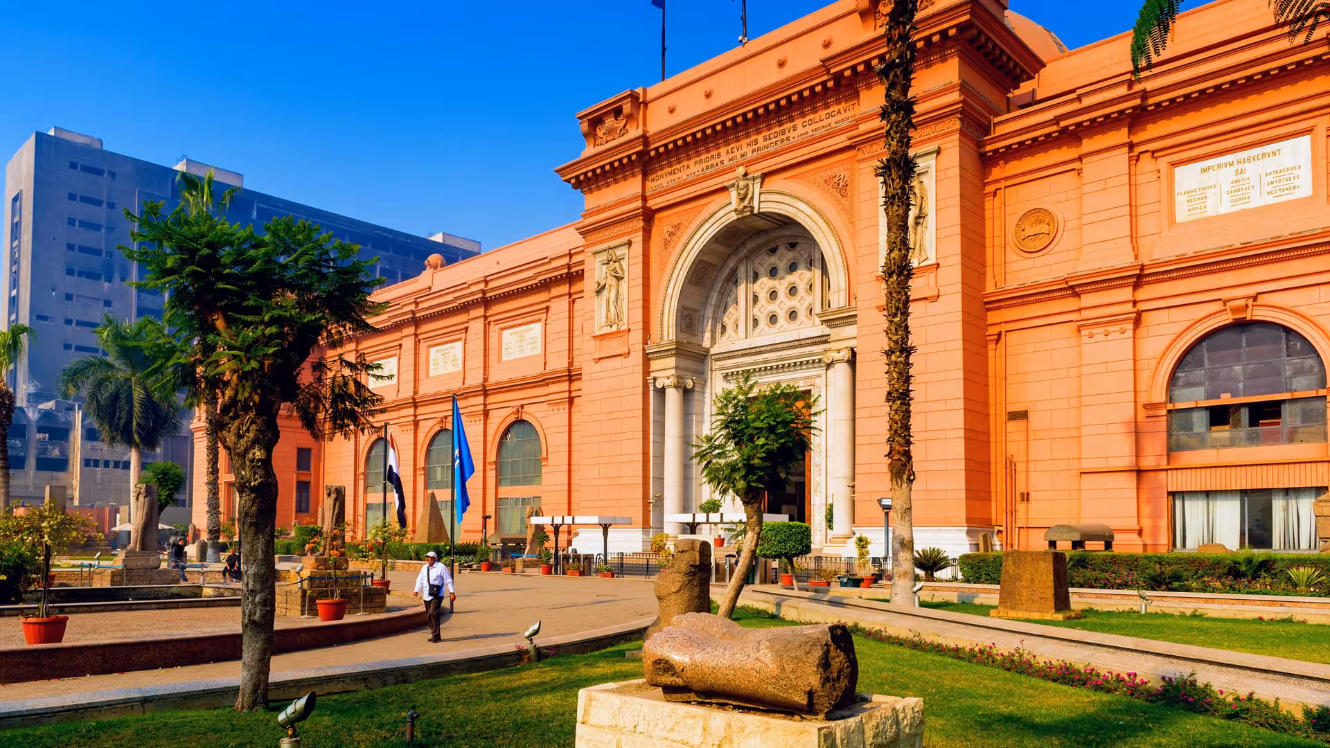 Egyptian Museum Cairo exterior on guided tour, historic pink facade and entrance in Tahrir Square