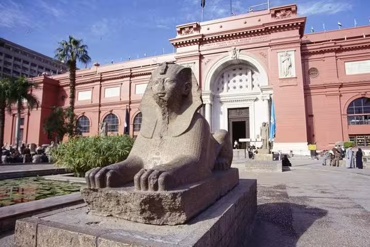 Egyptian Museum Cairo entrance with sphinx statue, Cairo day tour from Hurghada featuring ancient Egypt artifacts