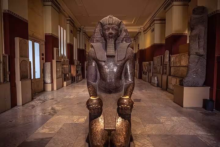 Granite seated pharaoh statue in Egyptian Museum of Antiquities Cairo, entry with QR skip-the-line ticket