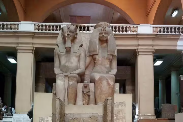 Colossal seated pharaoh statues in the Egyptian Museum Cairo during a private half-day guided tour
