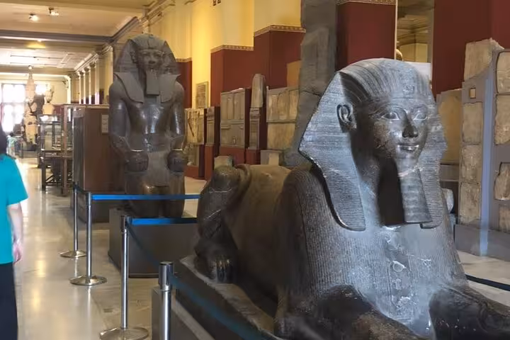 Egyptian Museum Cairo gallery with ancient sphinx statue, highlight of private Giza Pyramids tour
