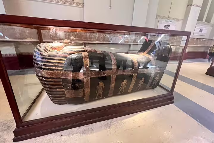 Painted ancient Egyptian sarcophagus at Cairo Museum on Pyramids of Giza day tour by plane from Sharm El Sheikh