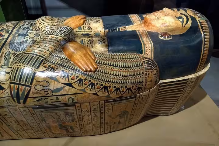Painted ancient Egyptian sarcophagus at the Egyptian Museum on Hurghada to Cairo full-day tour