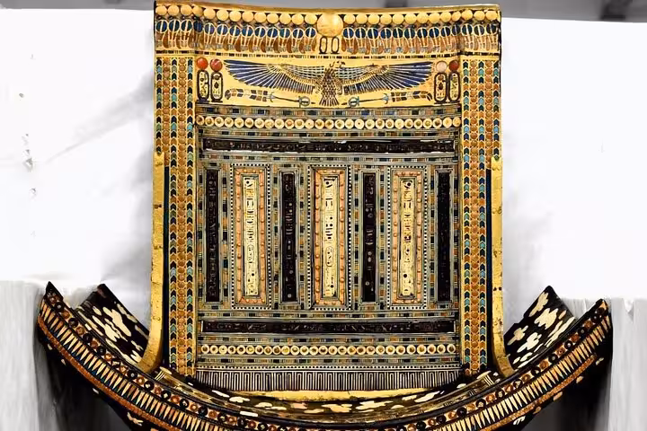 Ornate ancient Egyptian sarcophagus panel at Grand Egyptian Museum Cairo, Sharm El Sheikh pyramids day tour