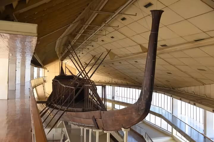 Ancient Egyptian solar boat display inside the Grand Egyptian Museum, highlight of private Giza guided tour