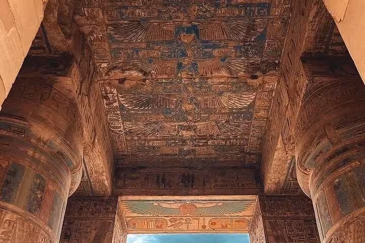 Painted ceiling and hieroglyphs inside an ancient Egyptian temple on a 7-day private Cairo tour