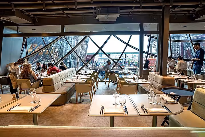 Elegant Eiffel Tower restaurant dining room for luxury lunch on private Paris tour with Seine cruise