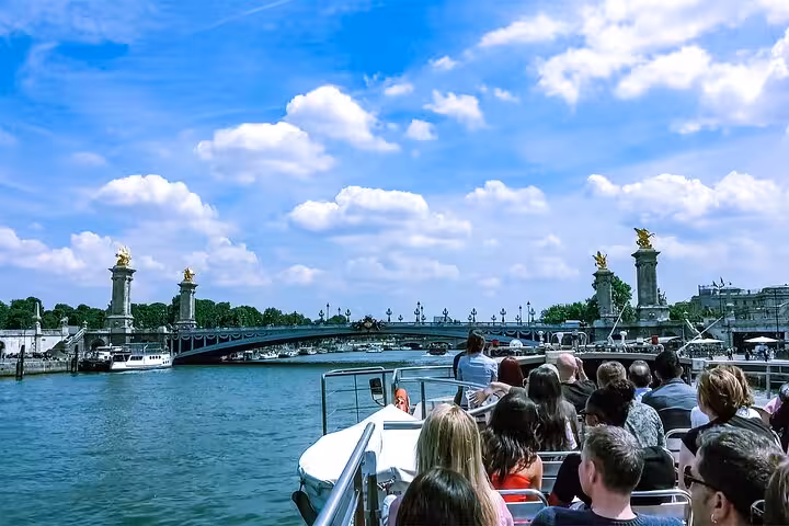 Seine River cruise with Paris bridge views on a private luxury tour with Eiffel Tower lunch and Louvre visit